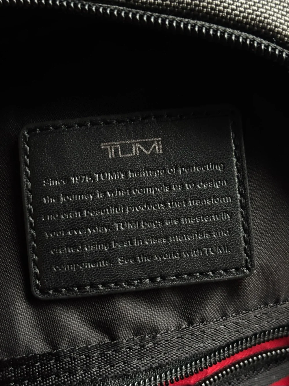 Tumi FIFE Gray SLIM Sling Bag dark grey and black.